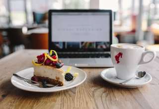 Working-in-a-restaurant-Macbook-Cheese-Cake-and-Cup-of-Coffee