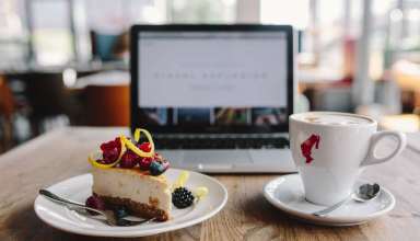 Working-in-a-restaurant-Macbook-Cheese-Cake-and-Cup-of-Coffee