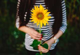 Young couple with sunflower