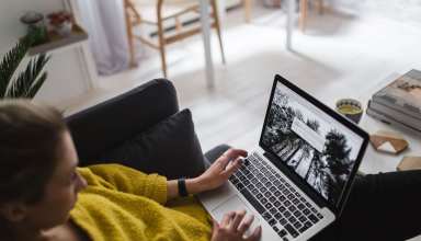 Young-woman-Working-Laptop - Wallpaper