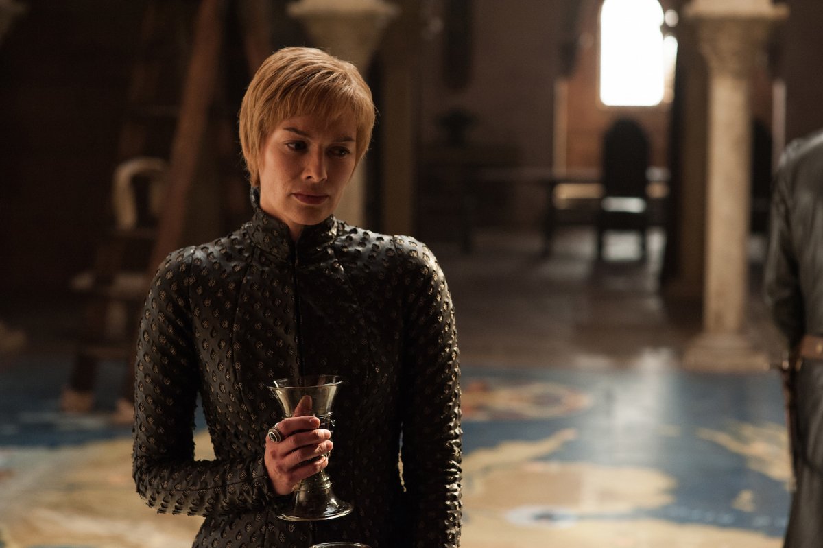 we-see-cersei-glass-of-wine-in-hand-as-usual-standing-on-a-huge-map-of-westeros