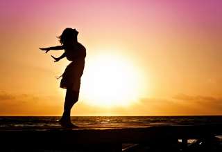 woman-happiness-sunrise-silhouette