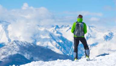 Sportsman Skiing Mountain Top Tourist Wallpaper