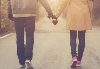 Couple in love holding hearts Wallpaper