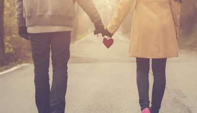 Couple in love holding hearts Wallpaper