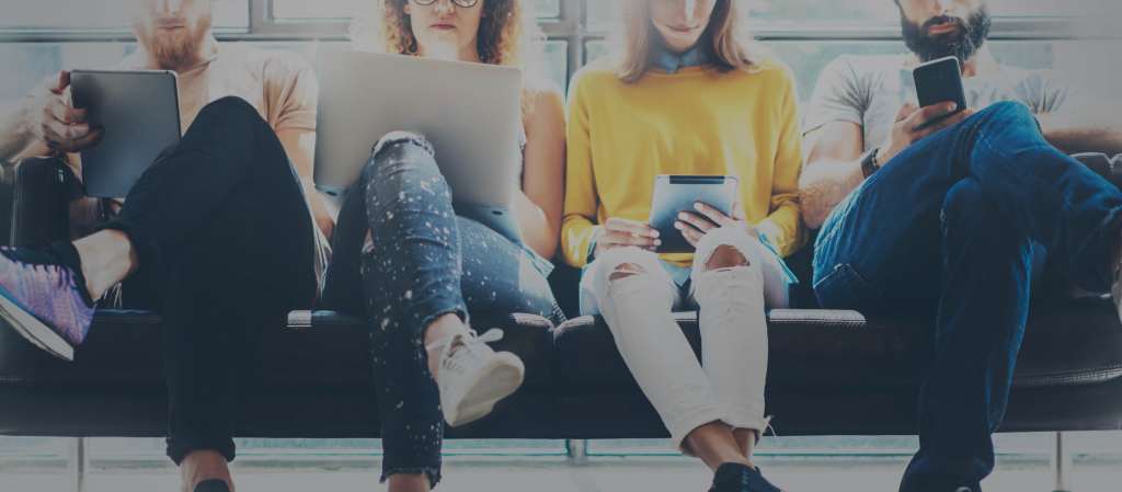 Group Adult Hipsters Friends Sitting Sofa Using Modern Gadgets Wallpaper