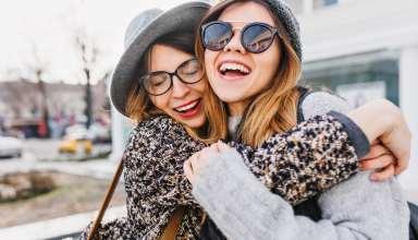 Happy brightful positive moments of two stylish girls Wallpaper