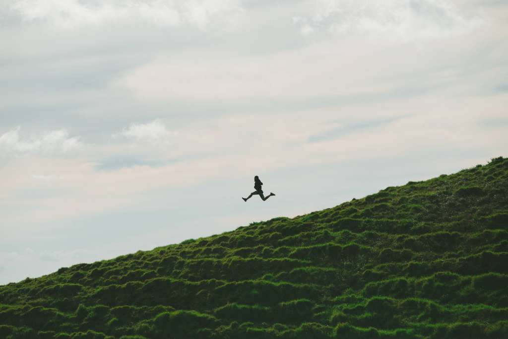 Man Jump Minimalism Sky Grass Wallpaper