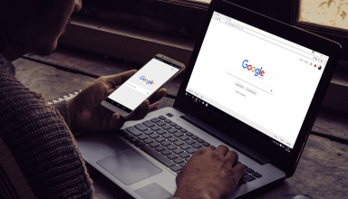 A man typing Google laptop