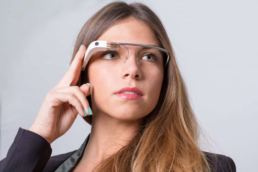 A woman wearing Google Glass Wallpaper