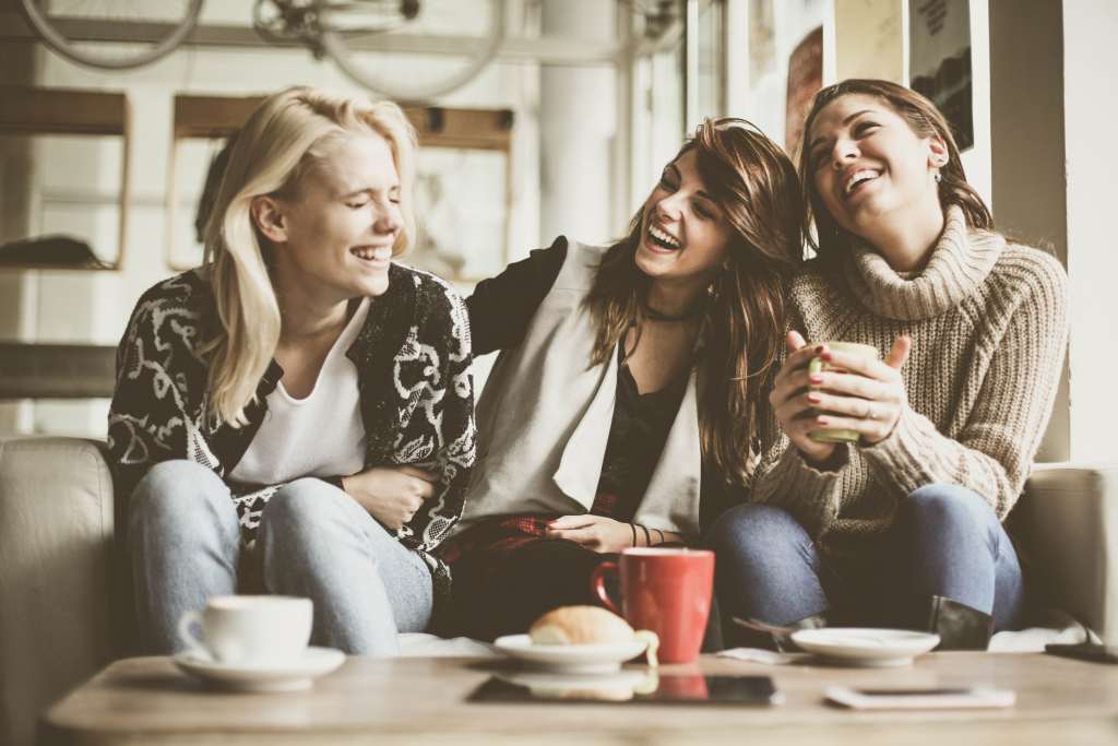 Girls having fun at home laughing