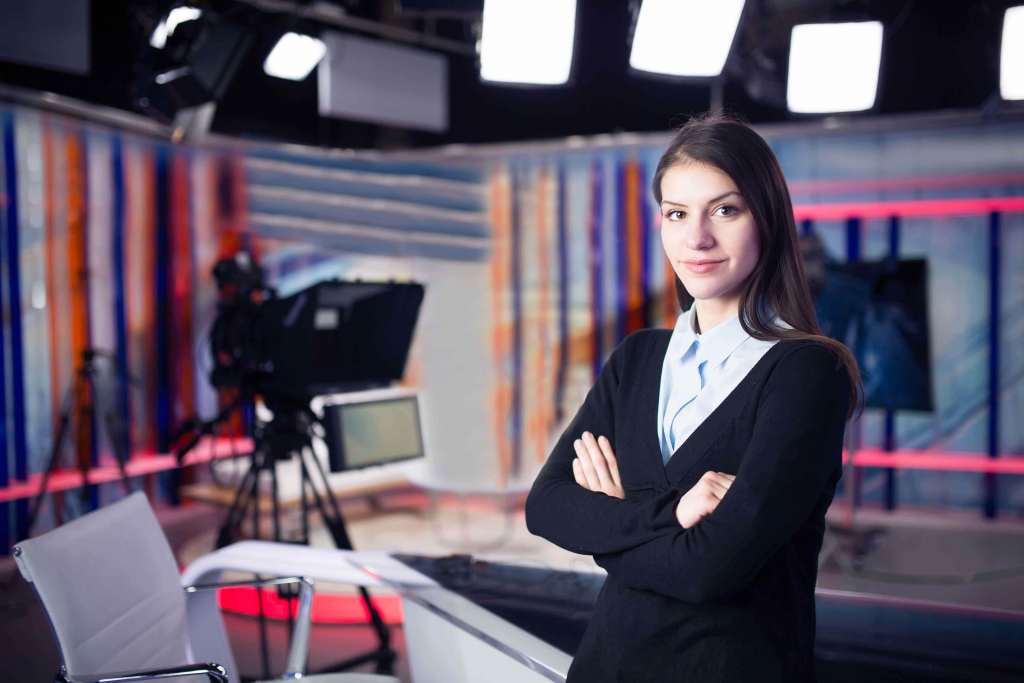 News writing and reporting.Woman journalist in television studio