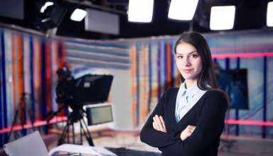 News writing and reporting.Woman journalist in television studio