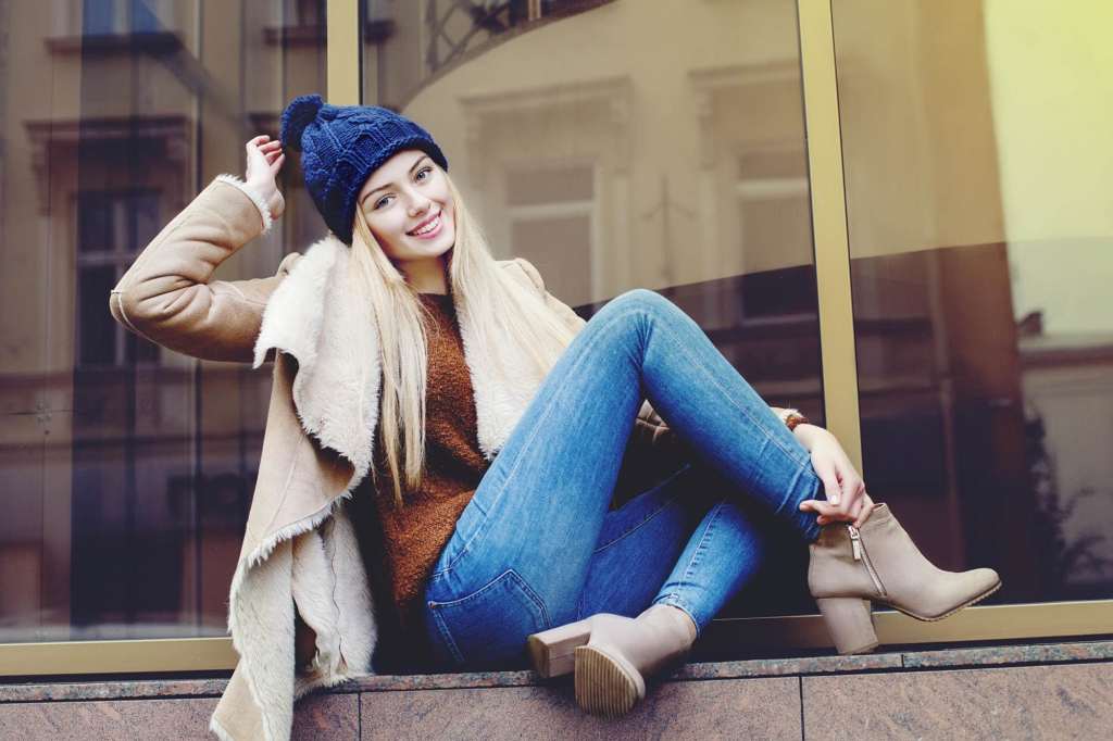 Outdoor portrait of beautiful happy smiling girl on street