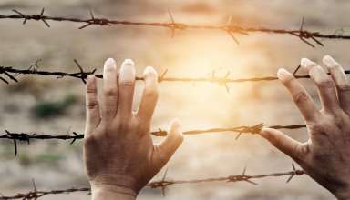 Woman hands rusty wire imprison, Human rights