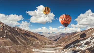 Balloons Sky Clouds Mountains Wallpaper