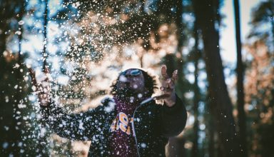 Man playing in snow Wallpaper