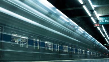 Time Lapse Photography of Train in Train Station Wallpaper