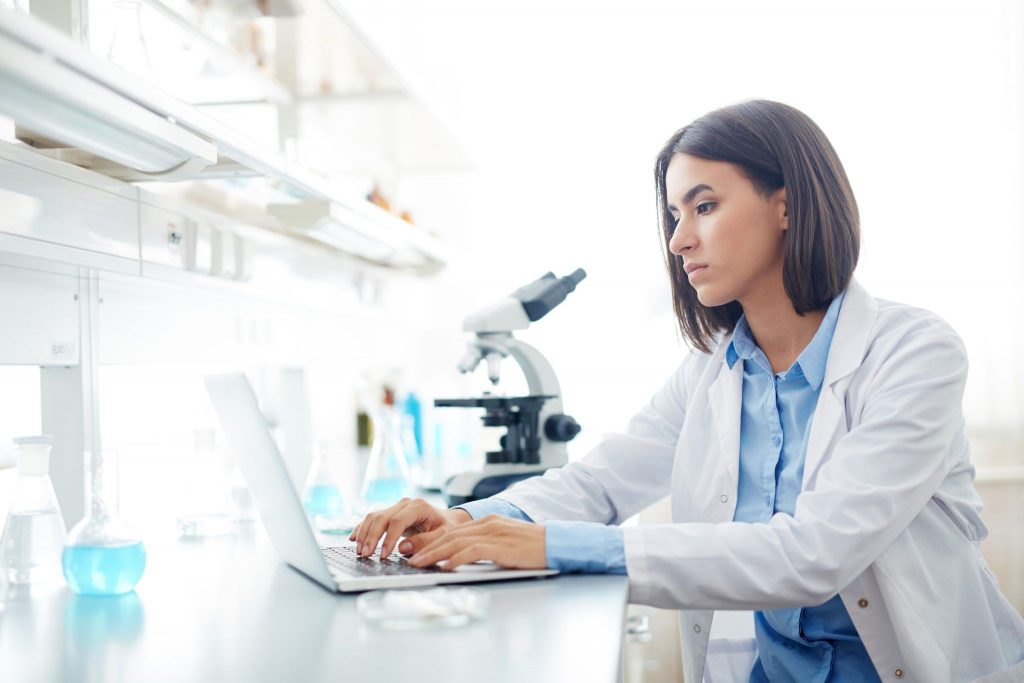 Woman Working in lab Wallpaper