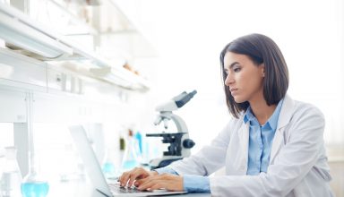 Woman Working in lab Wallpaper