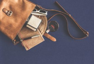 Brown Leather Crossbody Bag With White Framed Sunglasses