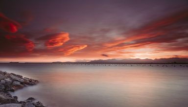 Rocks Near Body of Water During Sunset Wallpaper