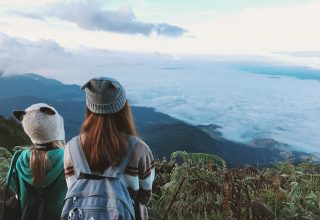 Two Woman White and Gray Crater Hat Wallpaper