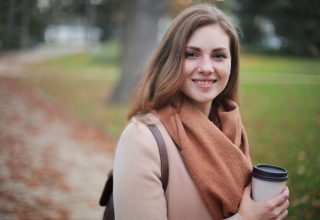 Woman Holding Disposable Cup Wallpaper