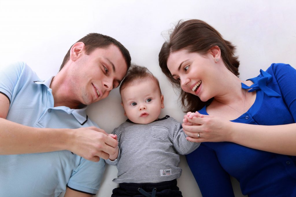 Man Beside Baby and Woman Wallpaper