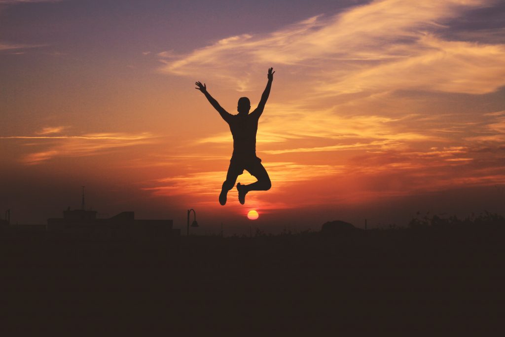 Man Silhouette Jump Sky Sunset Wallpaper