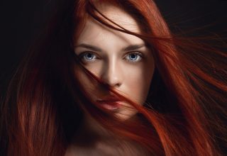 Redhead Girl Hairs on Face Wallpaper