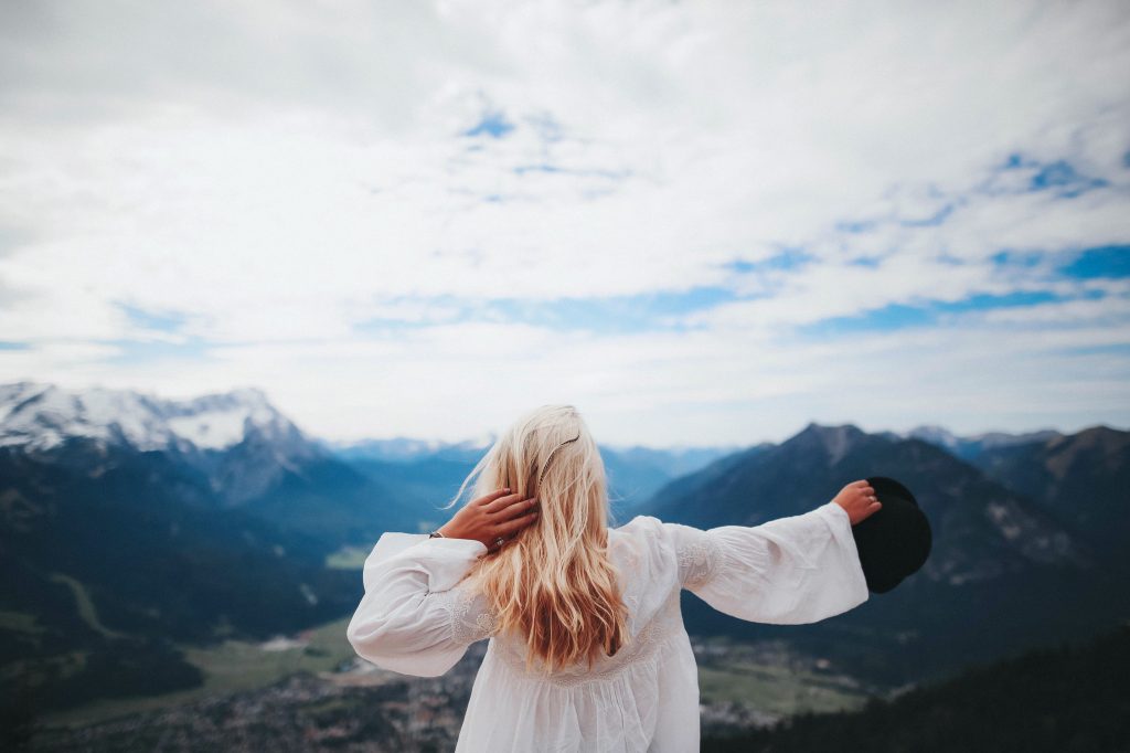 White Dressed Girl Across Black Mountains Wallpaper