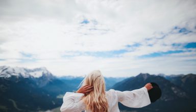 White Dressed Girl Across Black Mountains Wallpaper