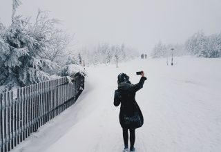 Woman in Snow Field Wallpaper