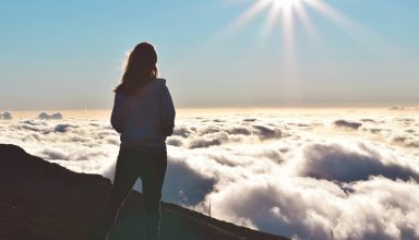 Woman Standing on Mountain Wallpaper