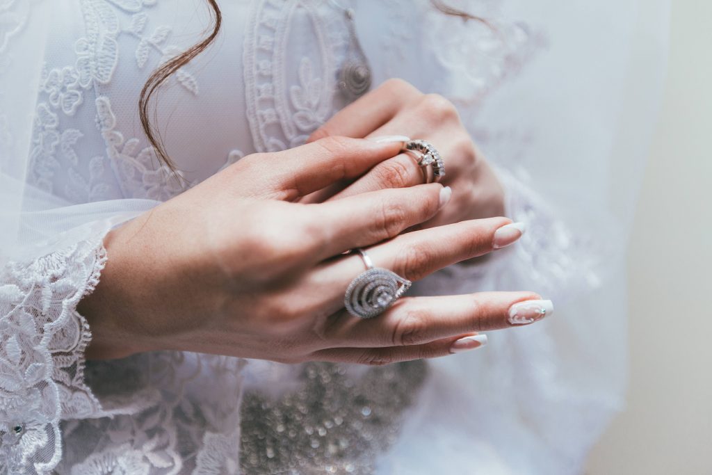 Womans hands wearing beautiful rings Wallpaper