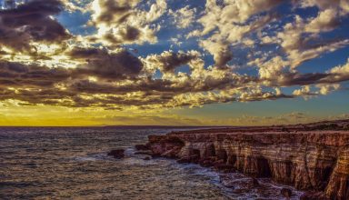 Cliff Sea Shore Stones Sky Wallpaper