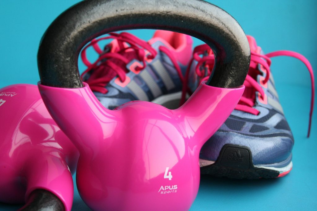 Kettle Bell Beside Adidas Pair of Shoes Wallpaper