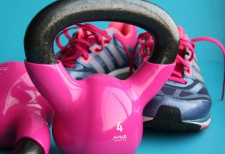 Kettle Bell Beside Adidas Pair of Shoes Wallpaper