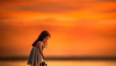 Little Girl on Beach Near Shutdown With Her Lantern Wallpaper